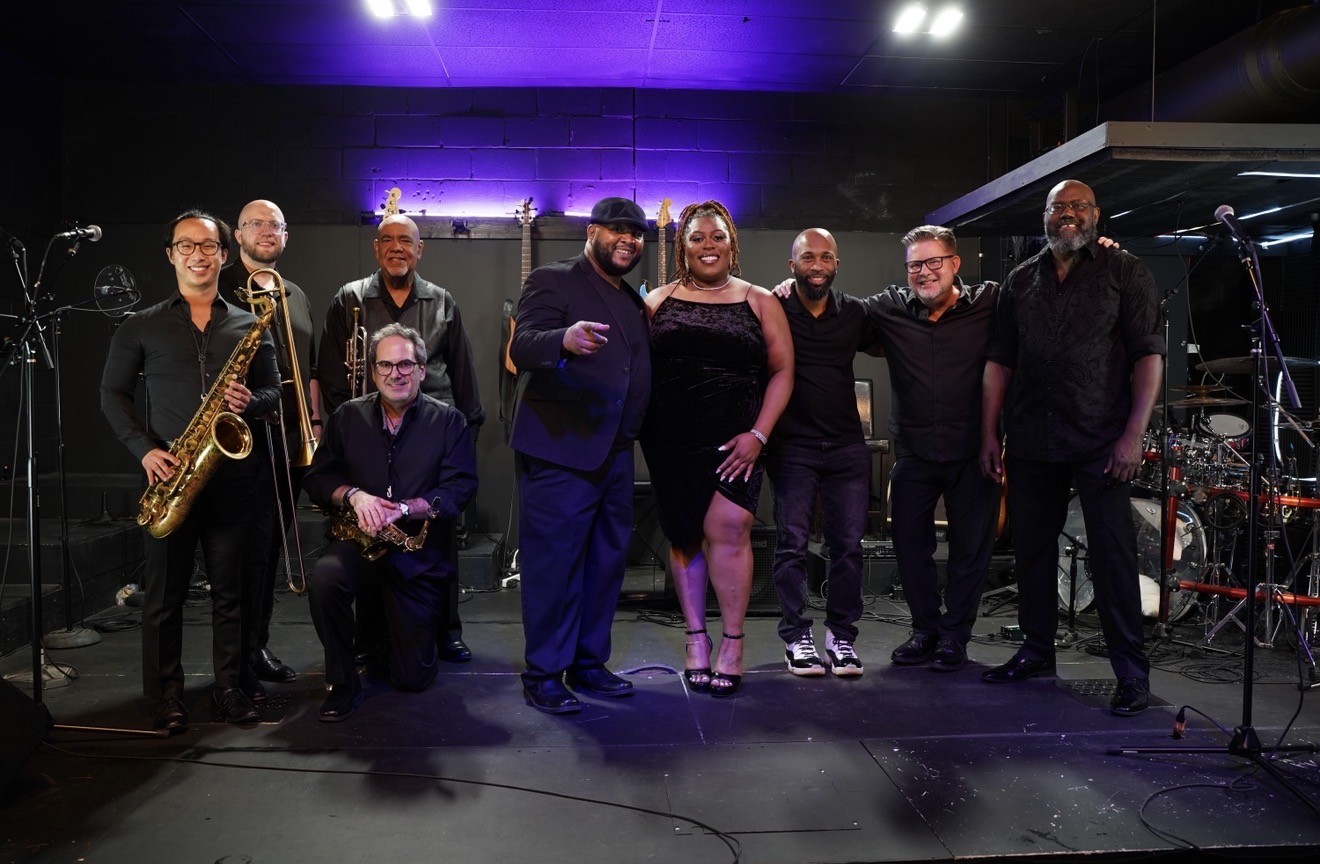 The Funk Junkies Band standing in a recording studio